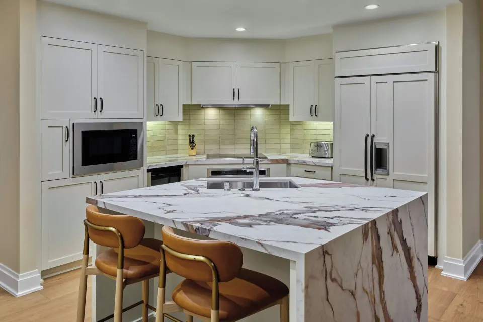Marble kitchen island and cabinetry in a residence at The Resort at Kapalua Bay, Maui