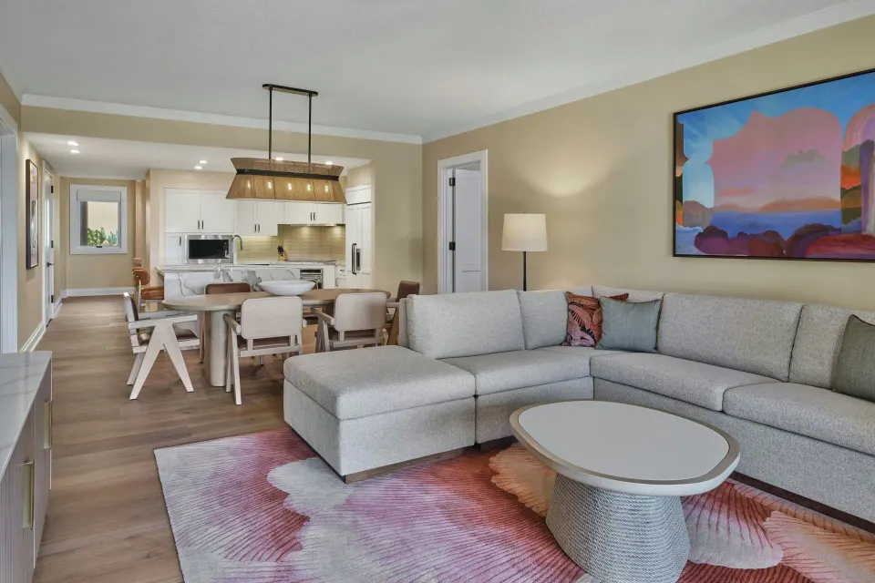 Living room with sectional sofa and dining area in a residence at The Resort at Kapalua Bay, Maui