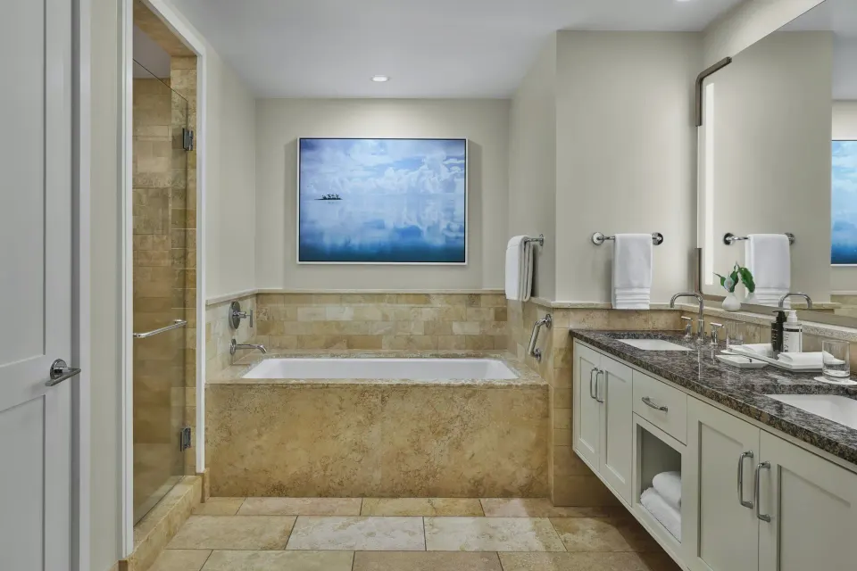 Soaking tub and double-sink vanity in a 3 Bedroom Residence Lanai Ocean View Room at The Resort at Kapalua Bay, Maui