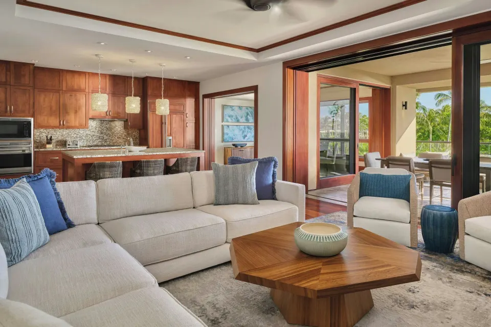 Residence living room opening to lanai with sectional sofa at The Resort at Kapalua Bay, Maui