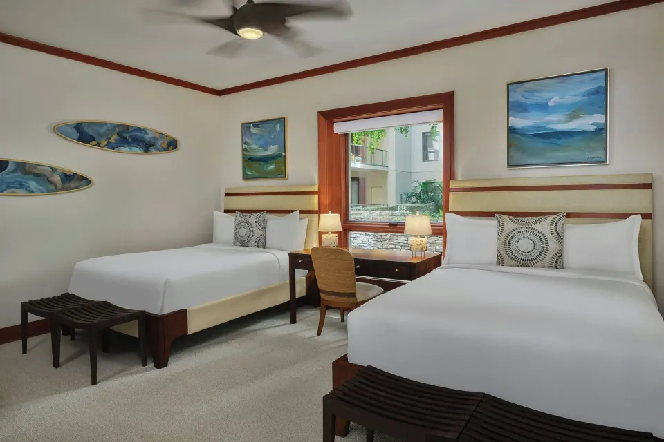 Guest room with two queen beds and desk at The Resort at Kapalua Bay, Maui