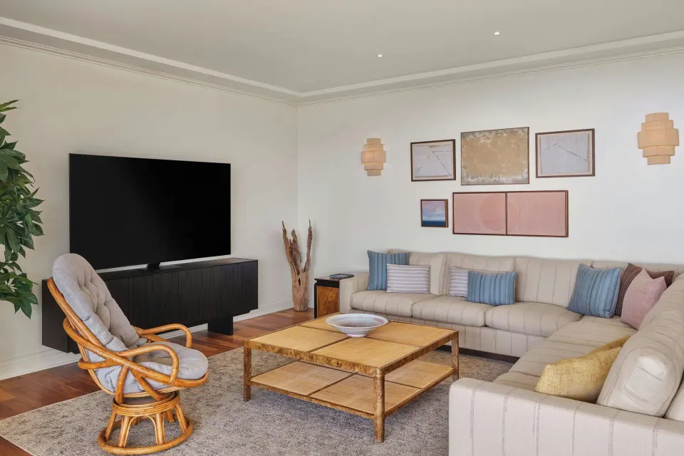 Living room with sectional sofa and TV at The Resort at Kapalua Bay, Maui