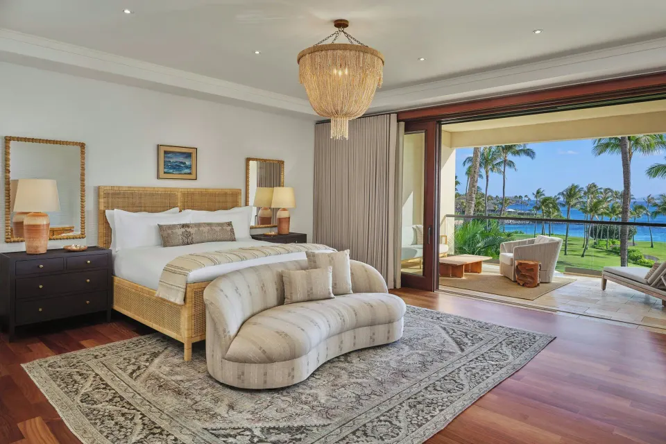 Bright oceanfront grand bedroom with king bed and lanai view at The Resort at Kapalua Bay, Maui