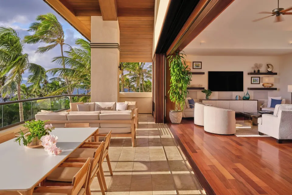 Lanai and living room with open wall and ocean views at The Resort at Kapalua Bay, Maui