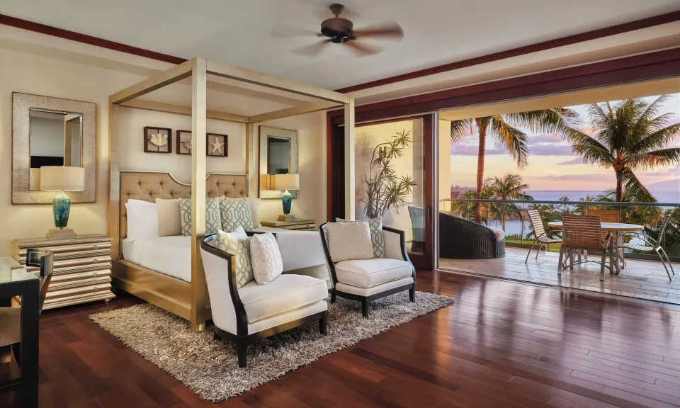 Lanai Four-Bedroom Premier king bedroom with canopy bed and balcony at The Resort at Kapalua Bay, Maui