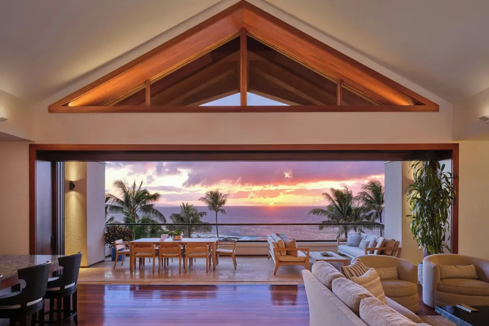 Open-plan Lanai Four-Bedroom Premier living area with ocean sunset at The Resort at Kapalua Bay, Maui