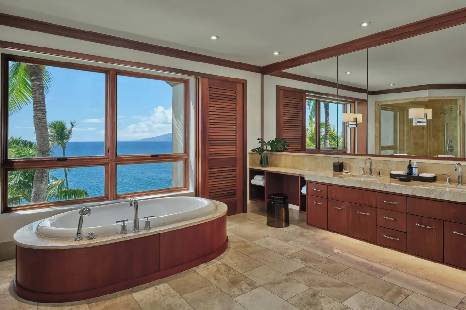 Lanai Four-Bedroom Premier master bathroom with soaking tub and ocean window at The Resort at Kapalua Bay, Maui
