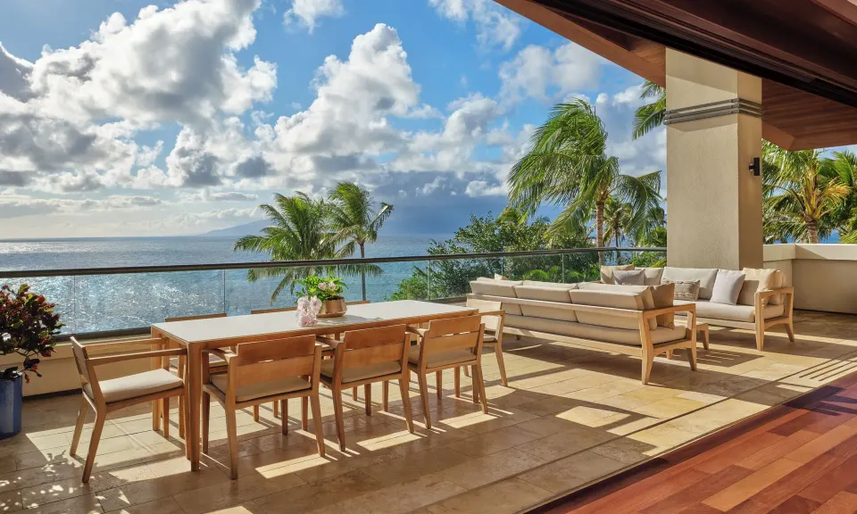 Lanai Four-Bedroom Premier oceanfront lanai with dining table and sofa at The Resort at Kapalua Bay, Maui