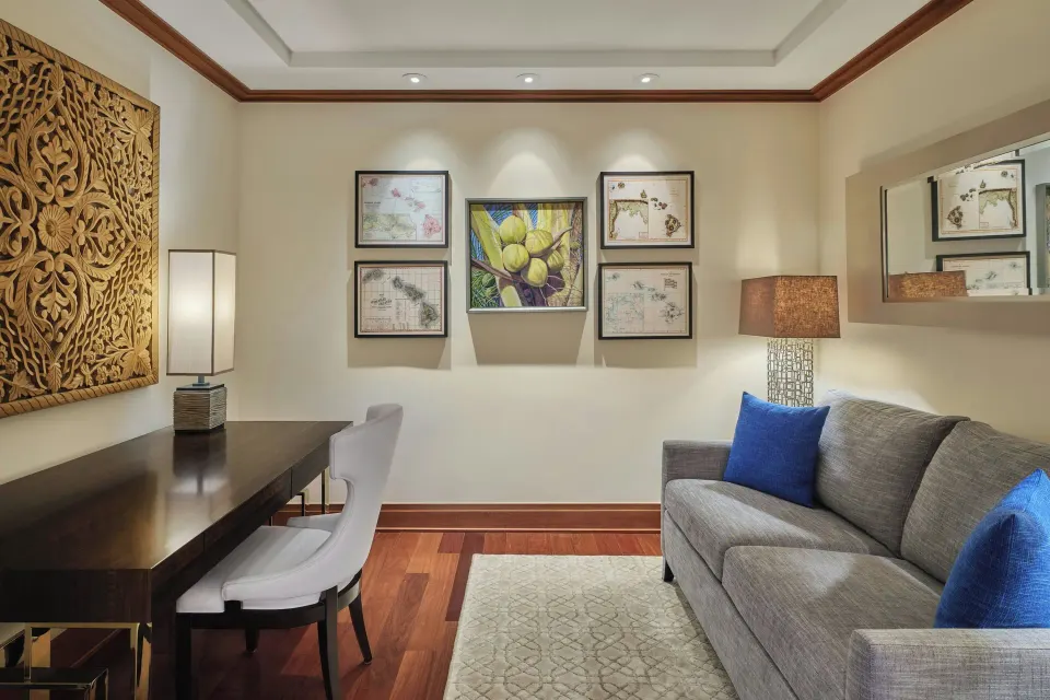 Sitting area with desk and sofa in Lanai Four-Bedroom Premier at The Resort at Kapalua Bay, Maui