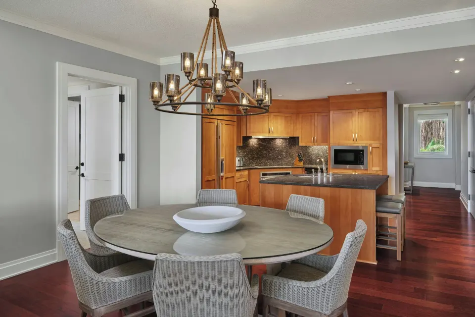 Dining area and kitchen in a three-bedroom residence at The Resort at Kapalua Bay, Maui