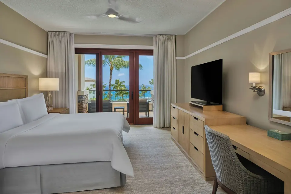 King bedroom with balcony and ocean view at The Resort at Kapalua Bay, Maui