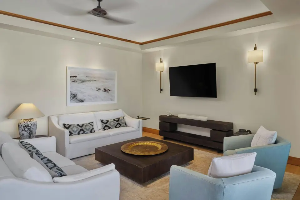 Signature 3 Bedroom Residence living room with sofa and kitchenette at The Resort at Kapalua Bay, Maui