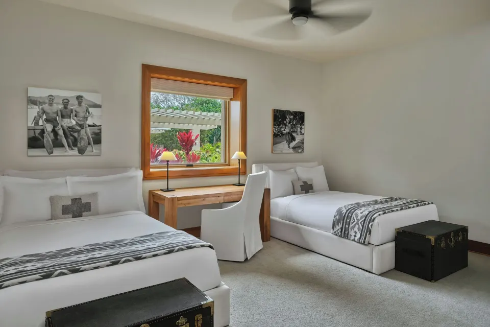 Twin-bedded guest room with two full beds and desk at The Resort at Kapalua Bay, Maui