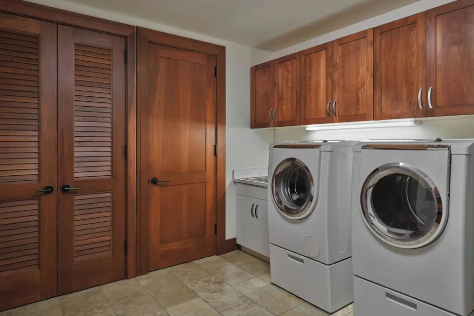 Laundry with full-size washer and dryer in a Signature 4 Bedroom Residence at The Resort at Kapalua Bay, Maui
