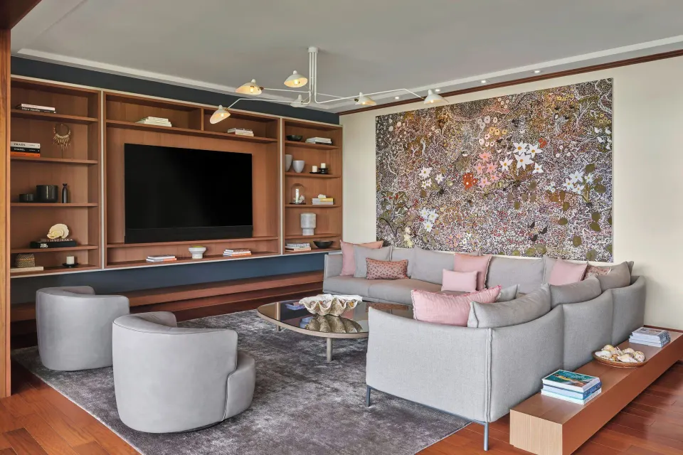 Living room with sectional sofa and built-in media wall in a Signature 4 Bedroom Residence at The Resort at Kapalua Bay, Maui