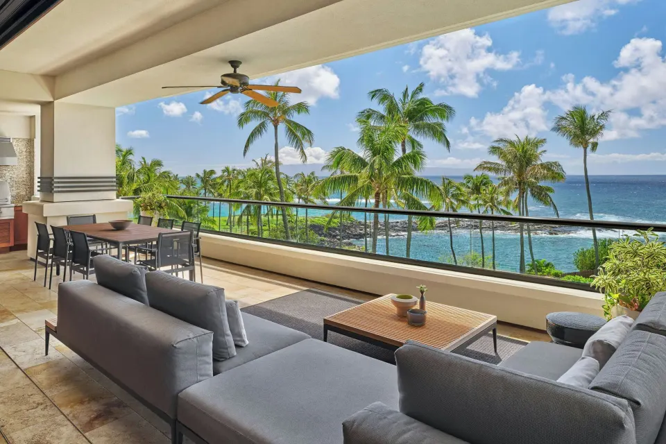 Oceanfront balcony seating and dining area at The Resort at Kapalua Bay, Maui