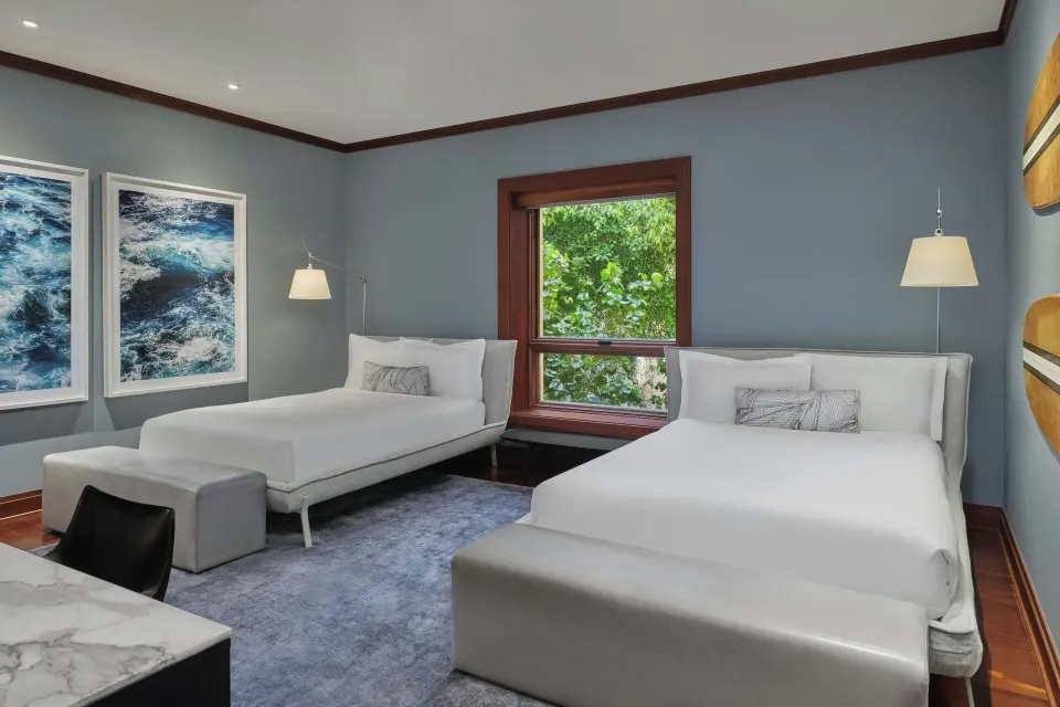 Twin beds in a guest bedroom of the Signature 4 Bedroom Residence at The Resort at Kapalua Bay, Maui