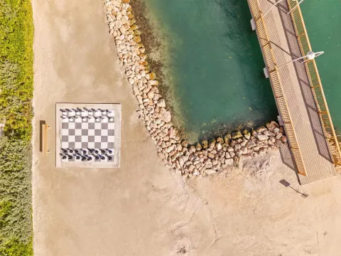 Aerial view of beach chessboard and rocky shoreline at The Rif at Mangrove Beach Corendon Curacao, Curio.