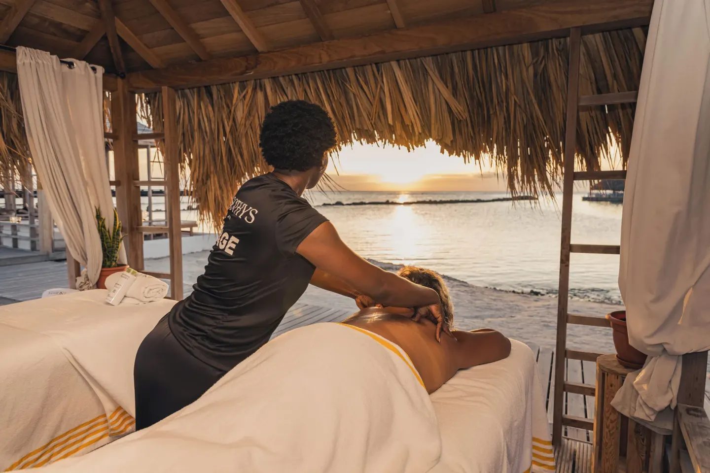 Beachfront massage under a palapa at The Rif at Mangrove Beach Corendon Curacao, Curio.