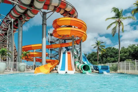 Close view of twisting water slides and splash pool at The Rif at Mangrove Beach Corendon Curacao, Curio.