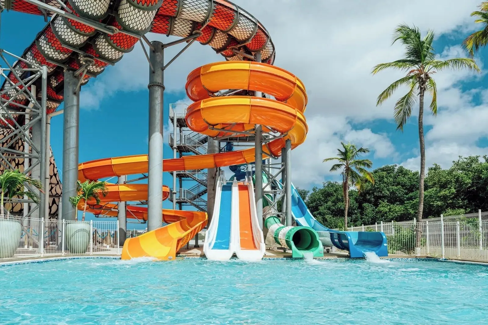 Close view of twisting water slides and splash pool at The Rif at Mangrove Beach Corendon Curacao, Curio.