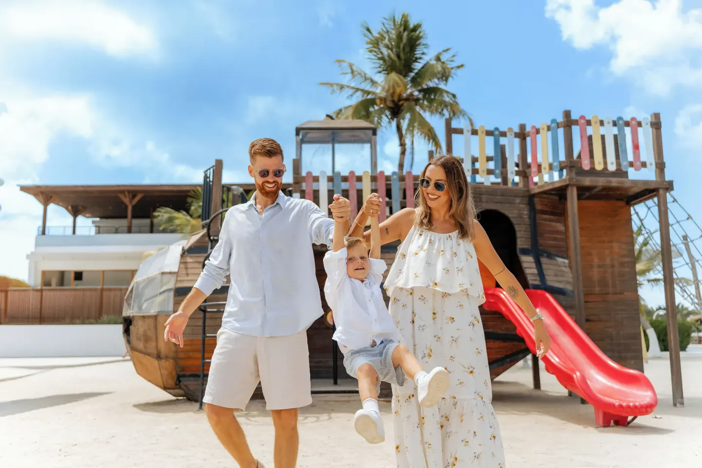 Family walking by the pirate ship playground at The Rif at Mangrove Beach Corendon Curacao, Curio.
