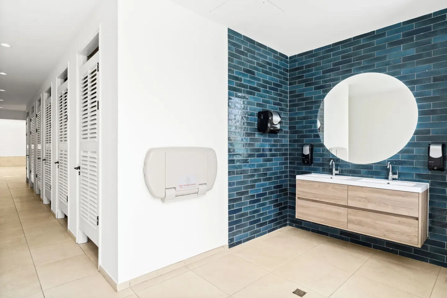 Restroom vanity and changing stalls at The Rif at Mangrove Beach Corendon Curacao, Curio.