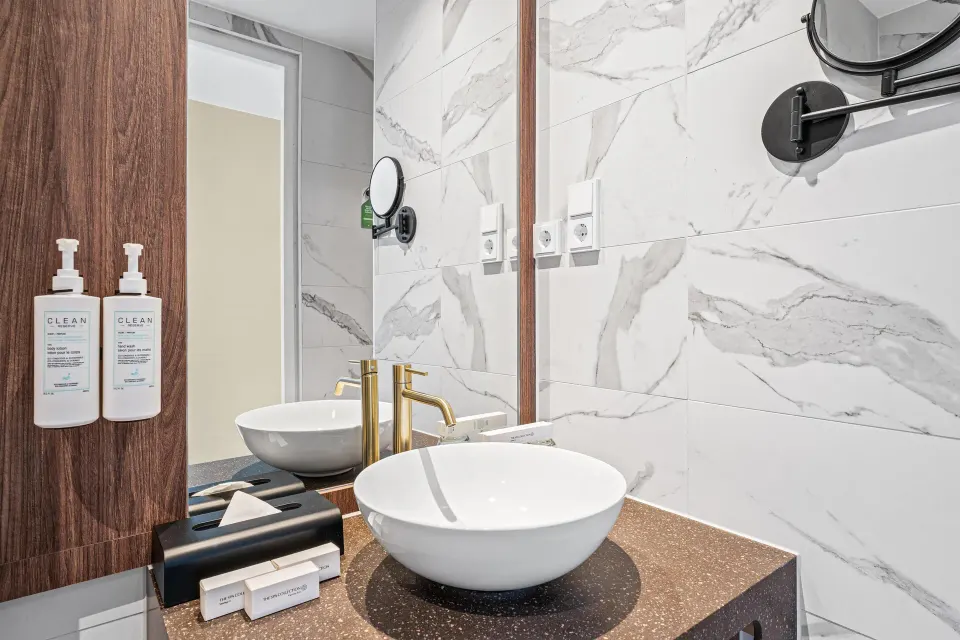 Bathroom vanity in a Deluxe Room, Partial Ocean View at The Rif at Mangrove Beach Corendon Curacao, Curio.