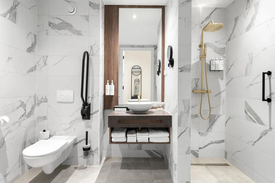 Accessible bathroom with roll-in shower at The Rif at Mangrove Beach Corendon Curacao, Curio.
