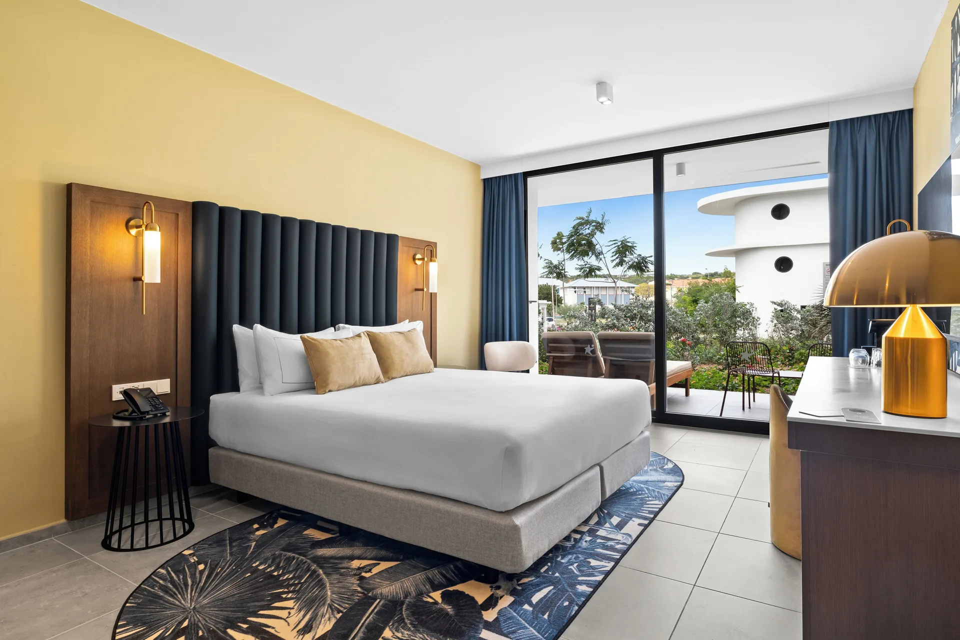 Deluxe Room king bed and terrace at The Rif at Mangrove Beach Corendon Curacao, Curio.