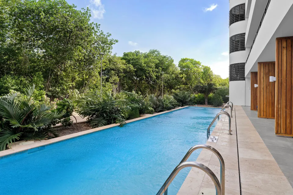Swim-up pool and greenery by Deluxe Rooms at The Rif at Mangrove Beach Corendon Curacao, Curio.
