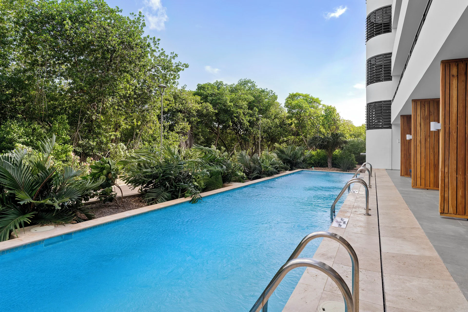 Swim-up pool and greenery by Deluxe Rooms at The Rif at Mangrove Beach Corendon Curacao, Curio.