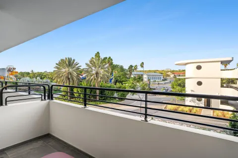 Deluxe Room balcony view with palms at The Rif at Mangrove Beach Corendon Curacao, Curio.