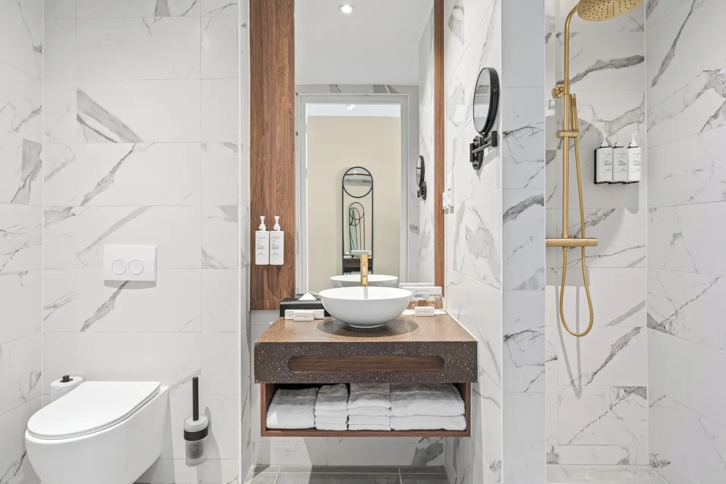 Deluxe Room bathroom with vanity, toilet and shower at The Rif at Mangrove Beach Corendon Curacao, Curio.