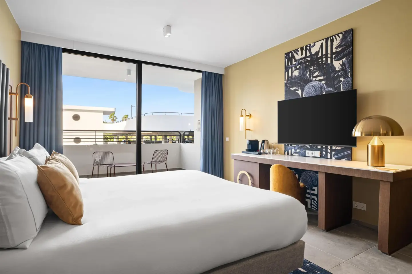 Deluxe Room with king bed, desk and balcony at The Rif at Mangrove Beach Corendon Curacao, Curio.