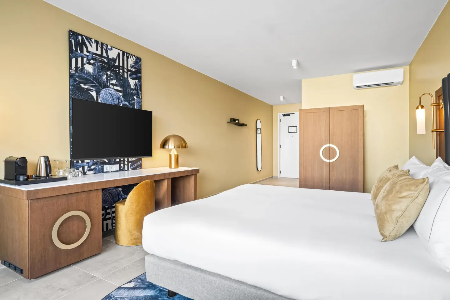 Deluxe Room with king bed, TV wall and wardrobe at The Rif at Mangrove Beach Corendon Curacao, Curio.