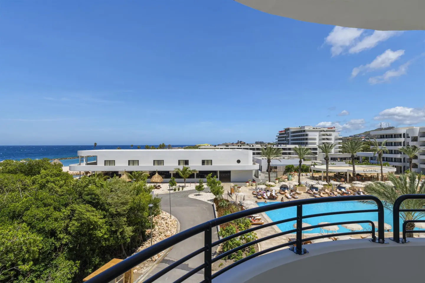 Ocean and pool view from the balcony of a Superior Suite at The Rif at Mangrove Beach Corendon Curacao, Curio.