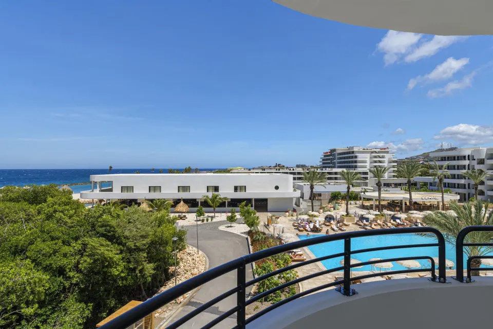 Ocean and pool view from the balcony of a Superior Suite at The Rif at Mangrove Beach Corendon Curacao, Curio.