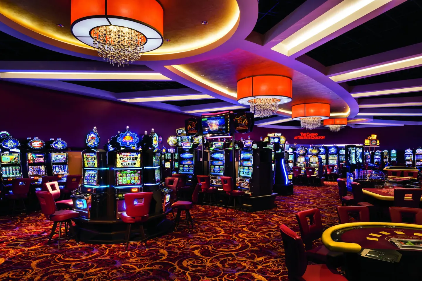Casino floor with slot machines and card tables at The Ritz-Carlton, Aruba.