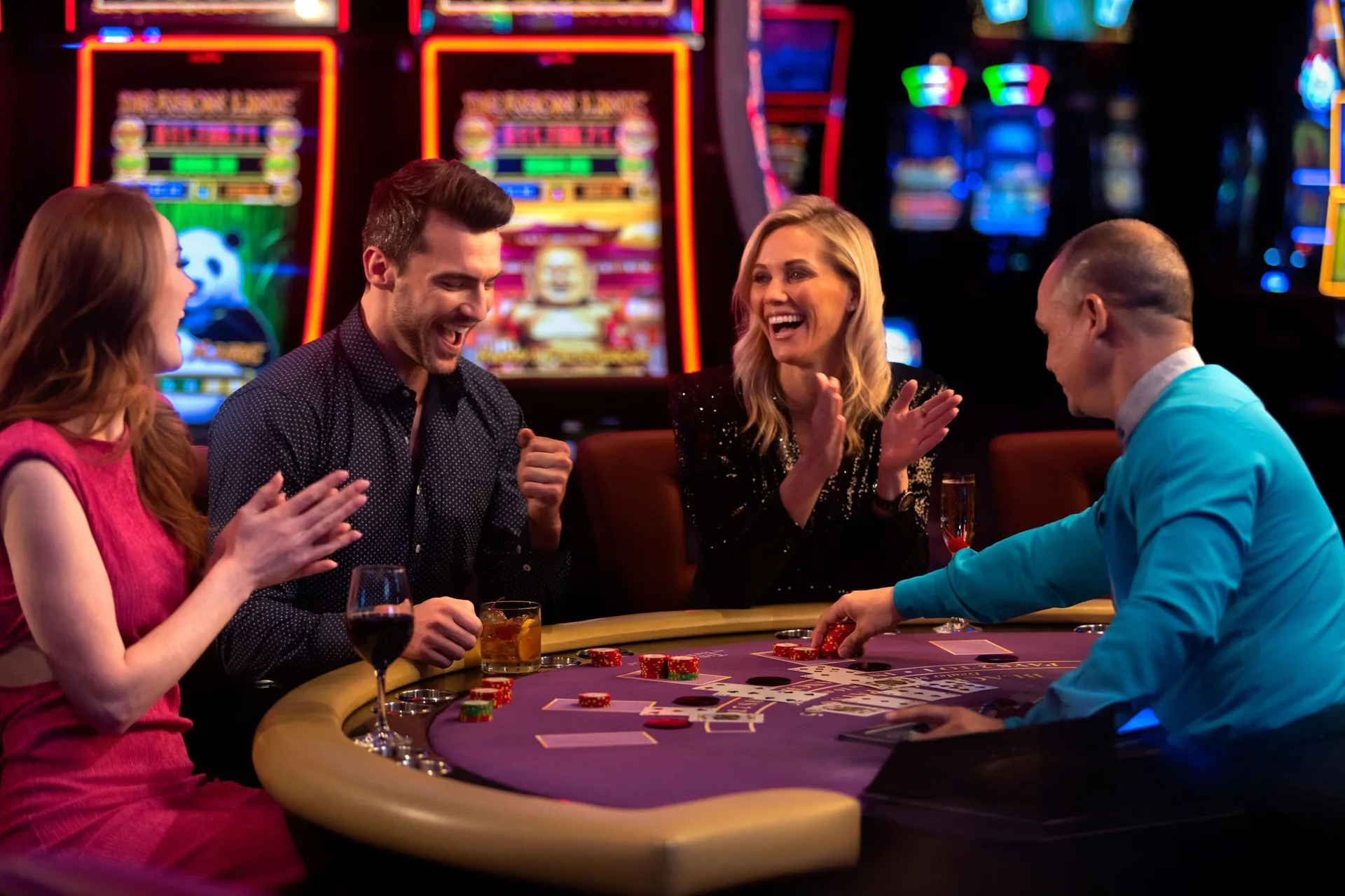Guests playing cards at a casino table at The Ritz-Carlton, Aruba.