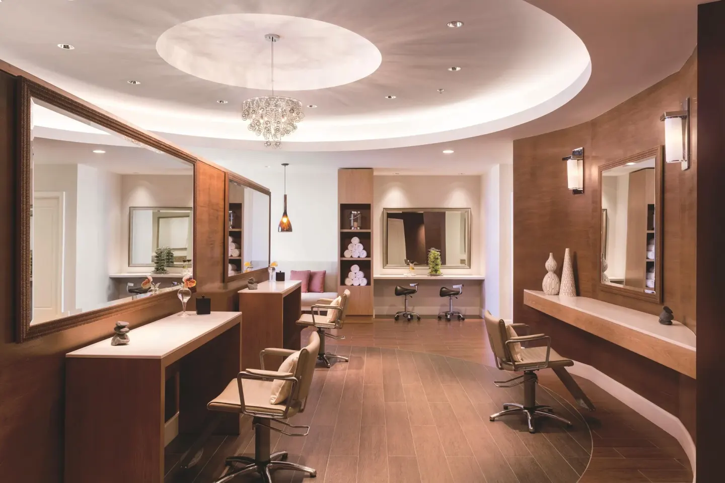 Salon styling stations with mirrors and chairs at The Ritz-Carlton, Aruba.