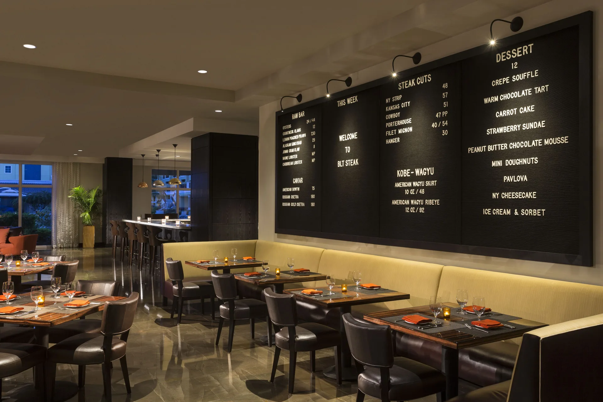 BLT Steak dining room with menu boards at The Ritz-Carlton, Aruba.