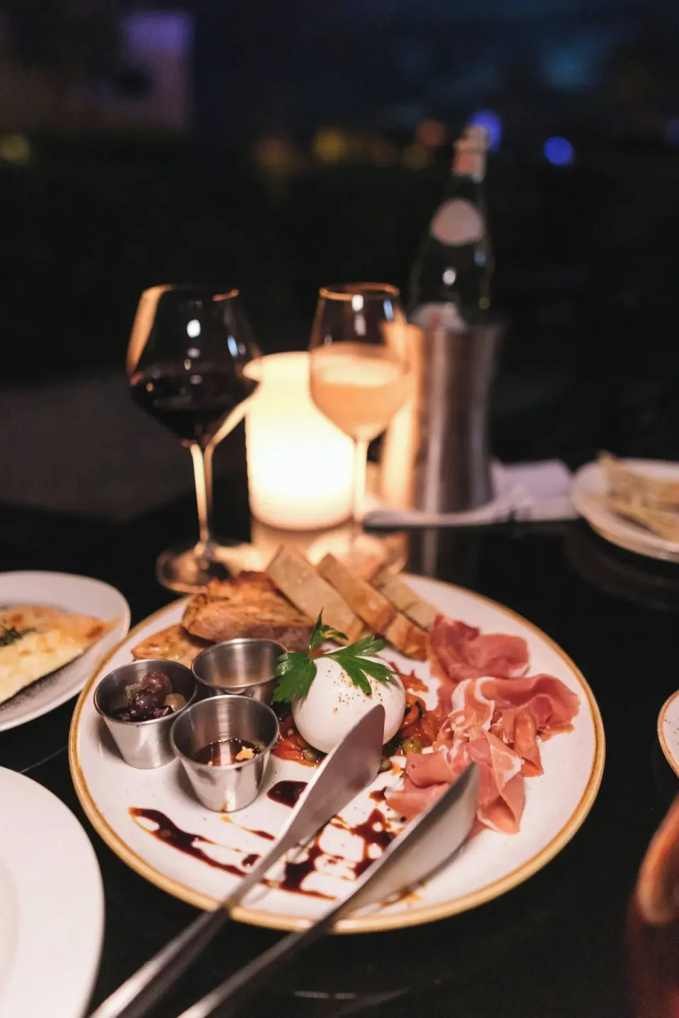 Italian antipasti platter with wine and candlelight at The Ritz-Carlton, Aruba.