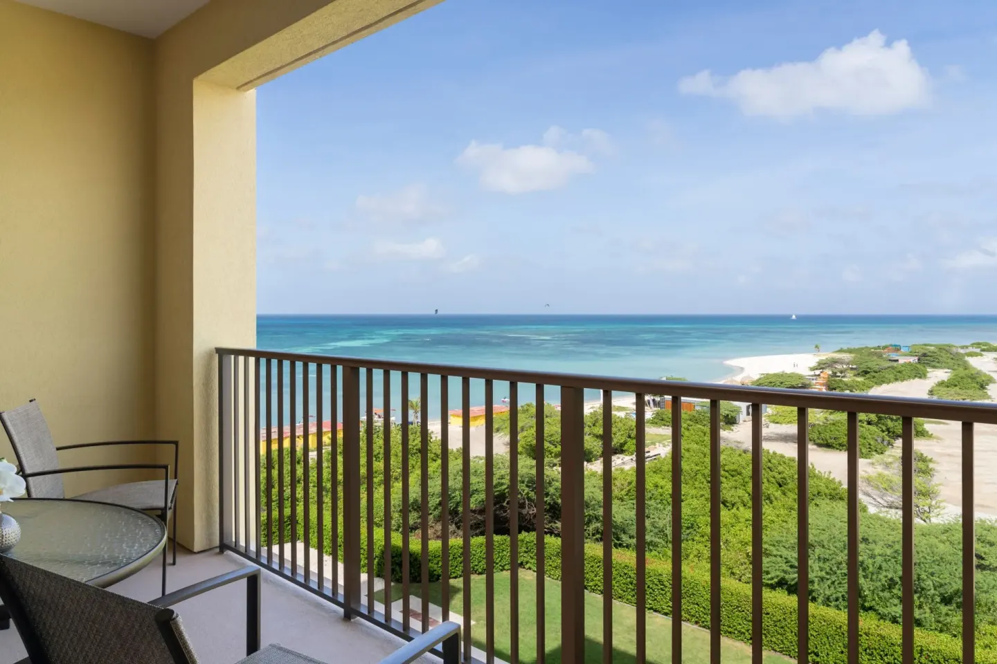 Balcony coastline view with turquoise water at The Ritz-Carlton, Aruba.