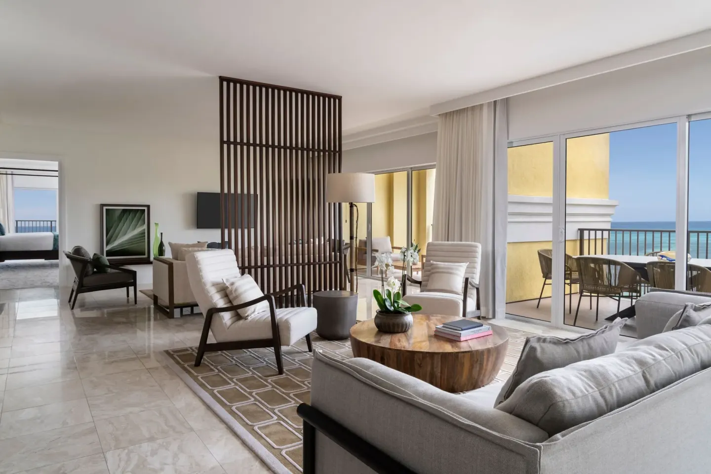 Presidential suite living room with balcony and ocean view at The Ritz-Carlton, Aruba.