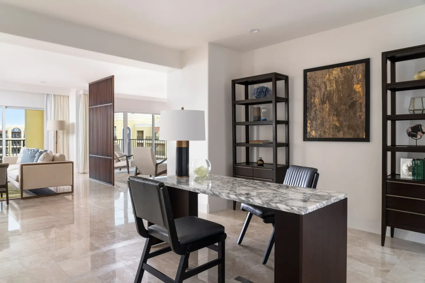 Presidential suite study with marble desk and lounge beyond at The Ritz-Carlton, Aruba.