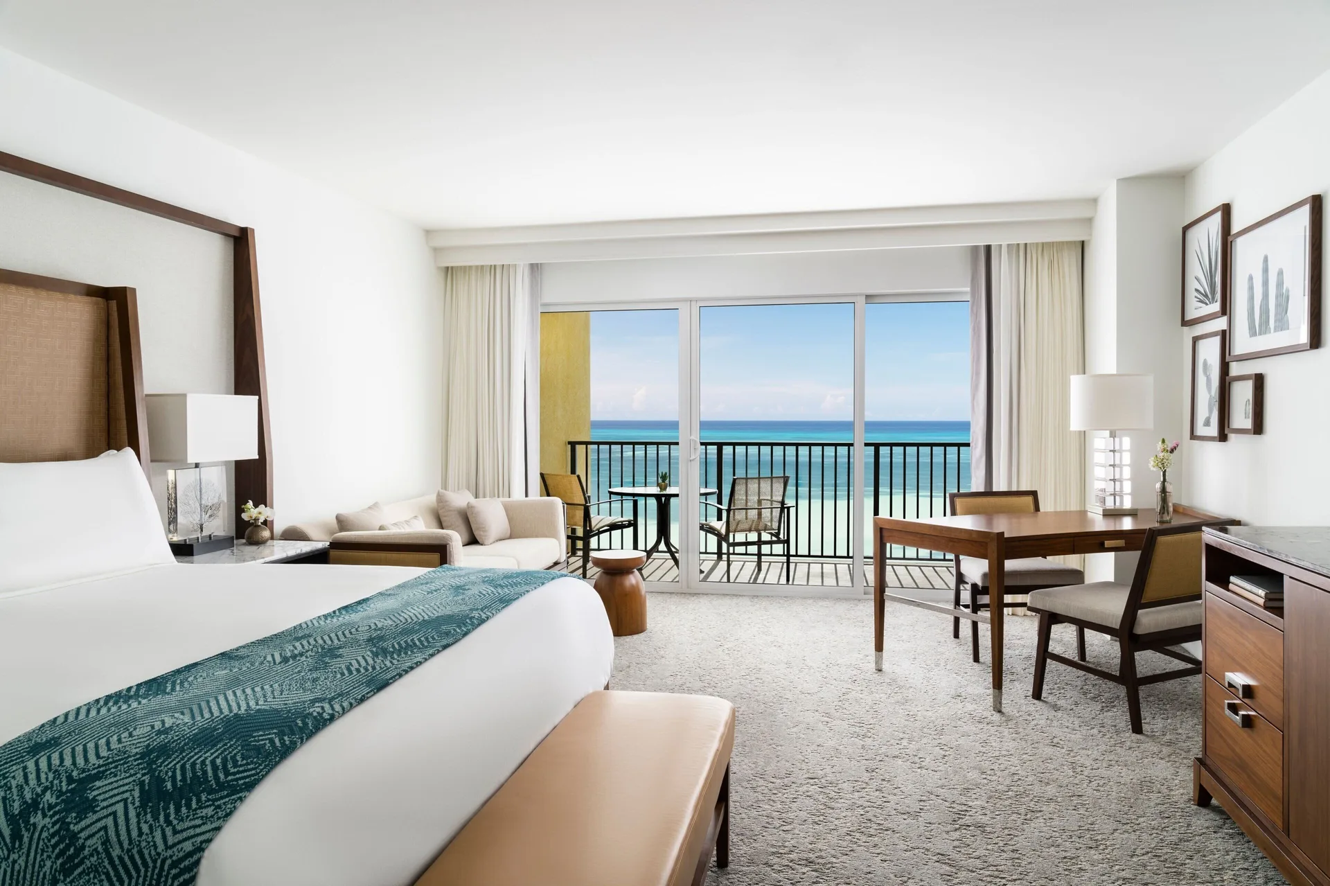 Oceanfront View Guest Room at The Ritz-Carlton, Aruba with king Bed, elegant décor, and direct Caribbean Sea views from Palm Beach.