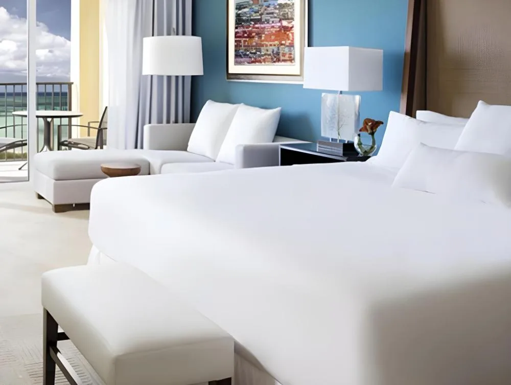 Standard guest room with king bed and balcony view at The Ritz-Carlton, Aruba.