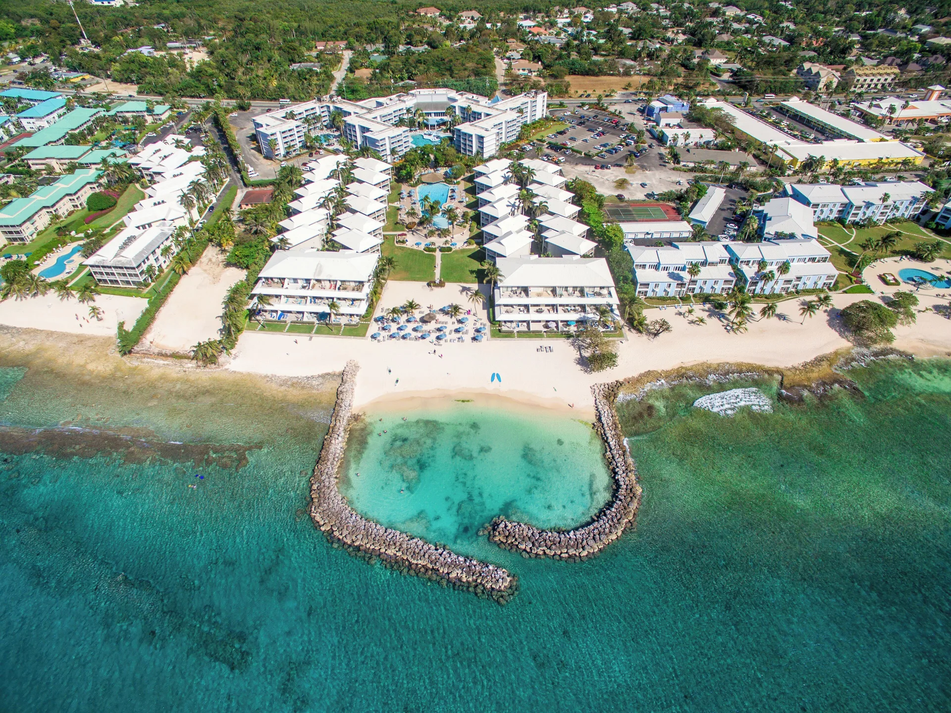 Sunset Cove Grand Cayman condo resort with beachfront lagoon and family-friendly vacation rentals
