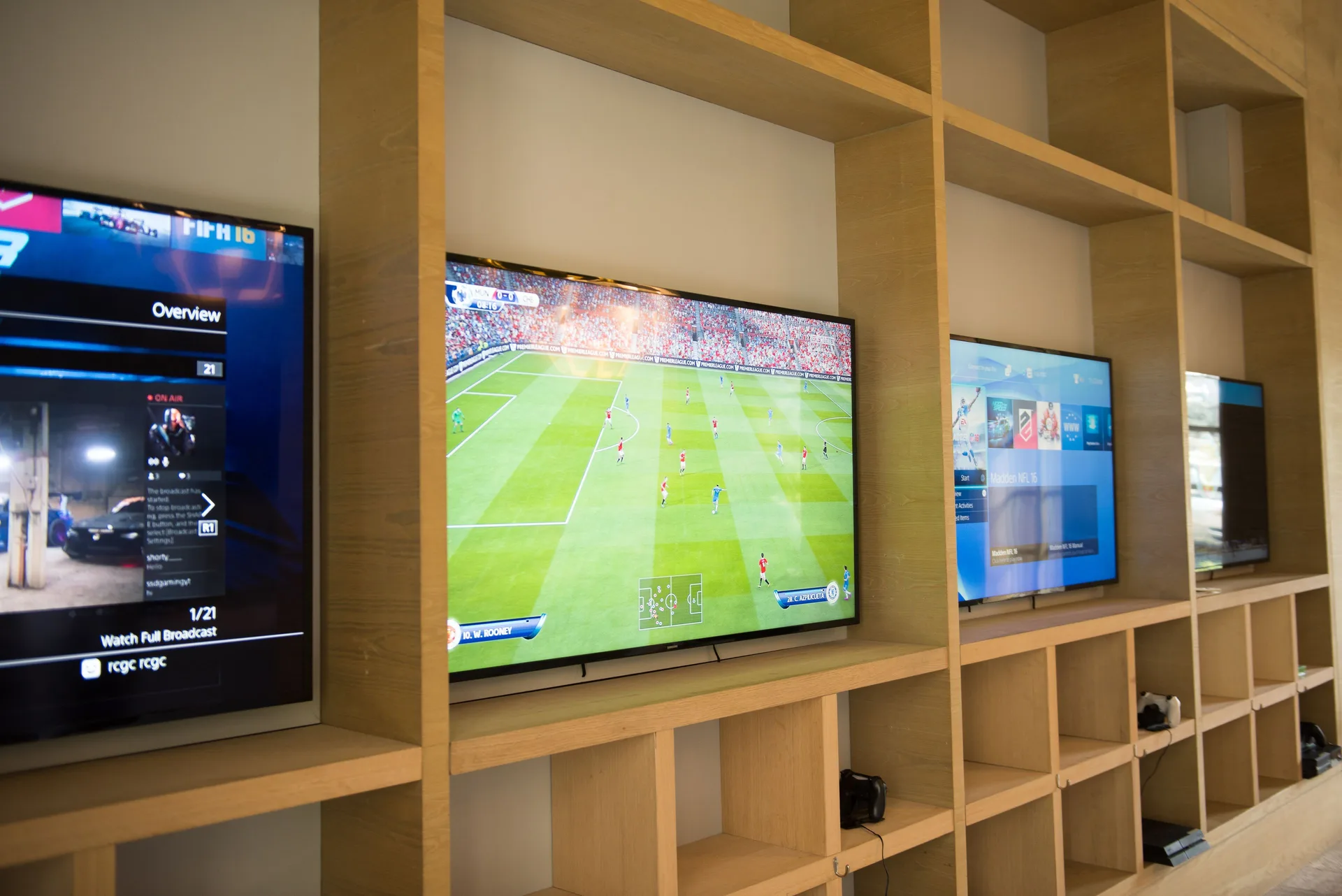 Wall-mounted screens show sports and games at The Ritz-Carlton, Grand Cayman.